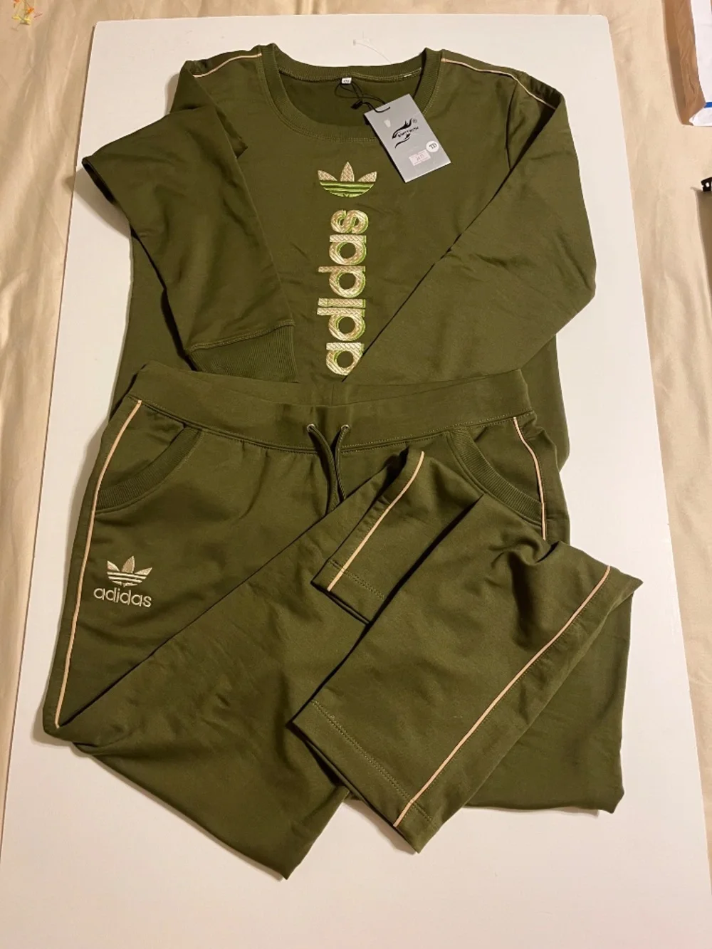 olive green Adidas matching sweatshirt and jogger set